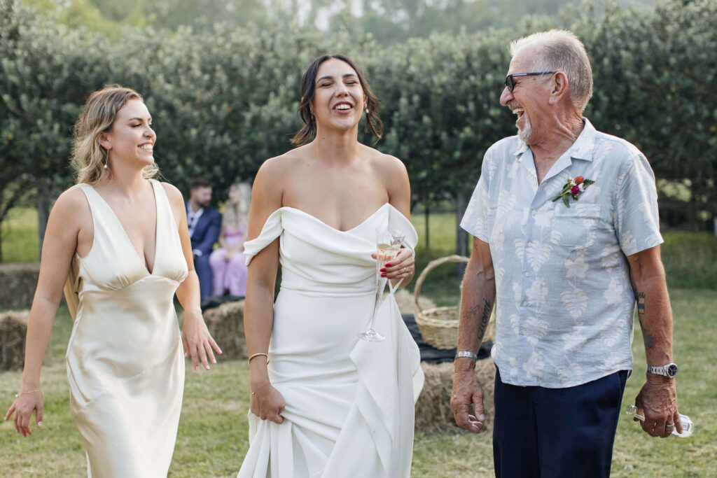 Guests celebrating on the outdoor dance floor at Whangamata Farm Weddings, joyful Whangamata wedding moments.