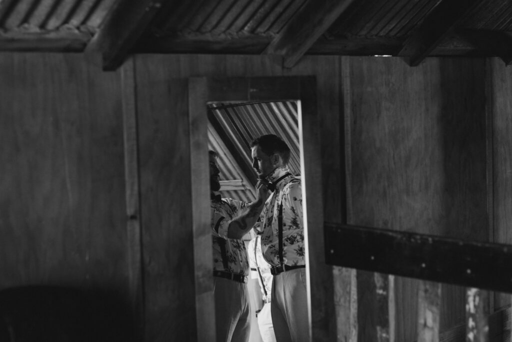 Groom getting ready at The Red Barn