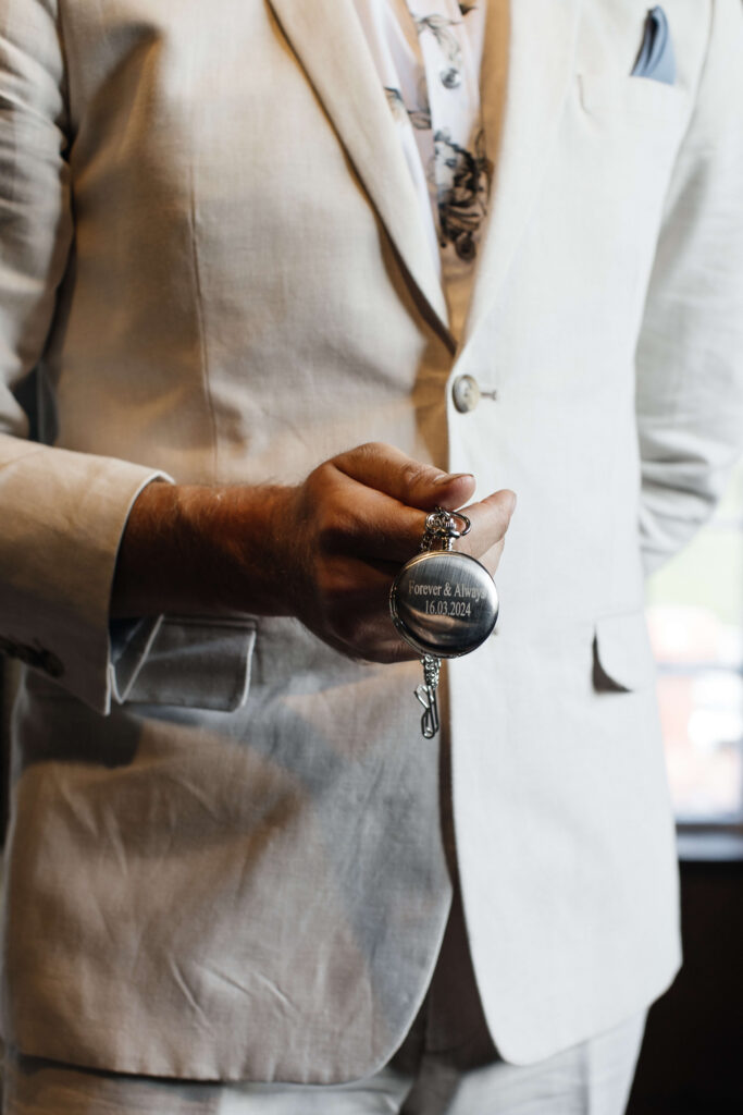 Groom getting ready at The Red Barn