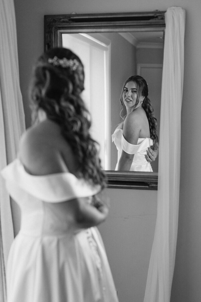 bride puts her dress on