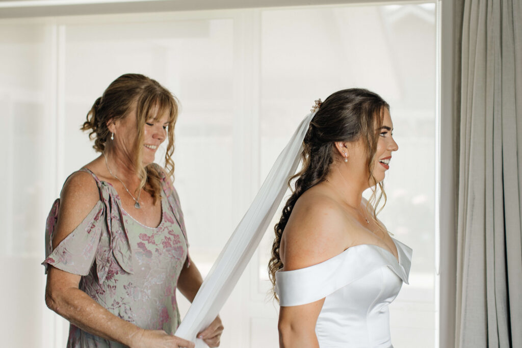 bride puts her dress on