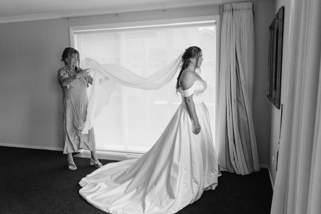 bride puts her dress on