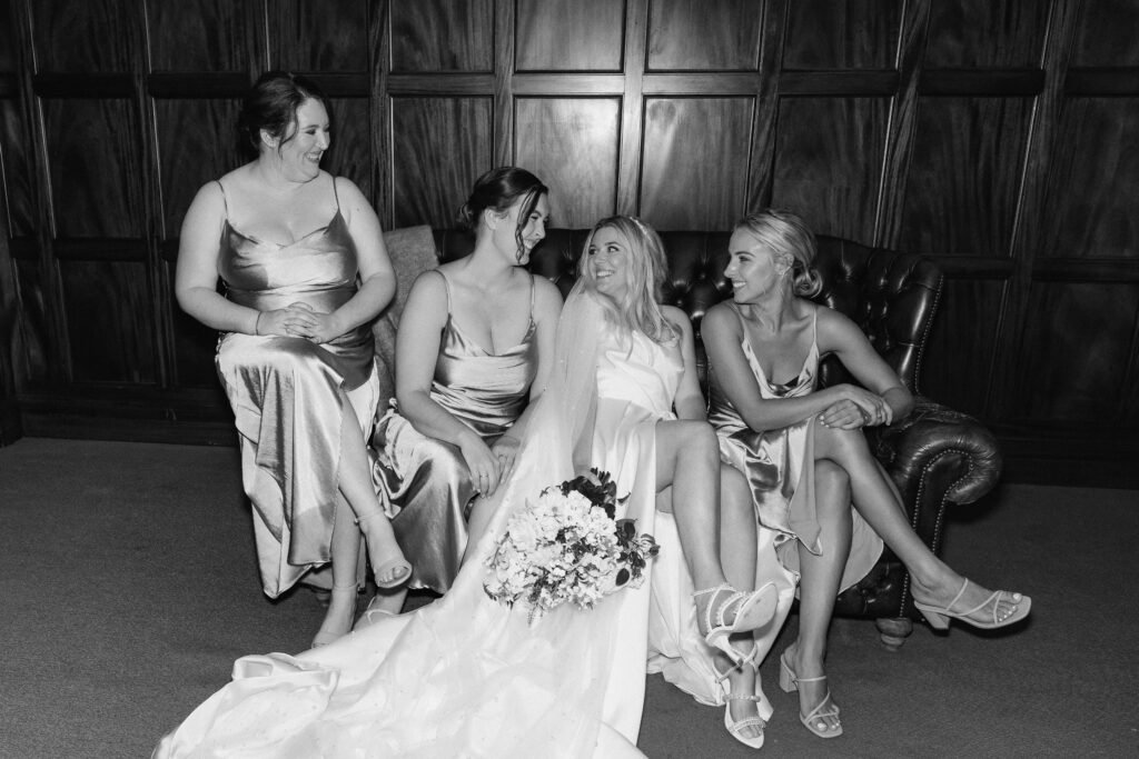 Elegant bridal party portrait inside Puketutu Island Estate Spanish Mansion room