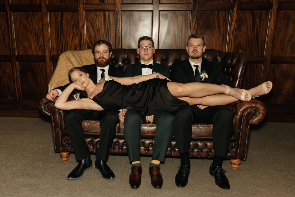 Elegant bridal party portrait inside Puketutu Island Estate Spanish Mansion room