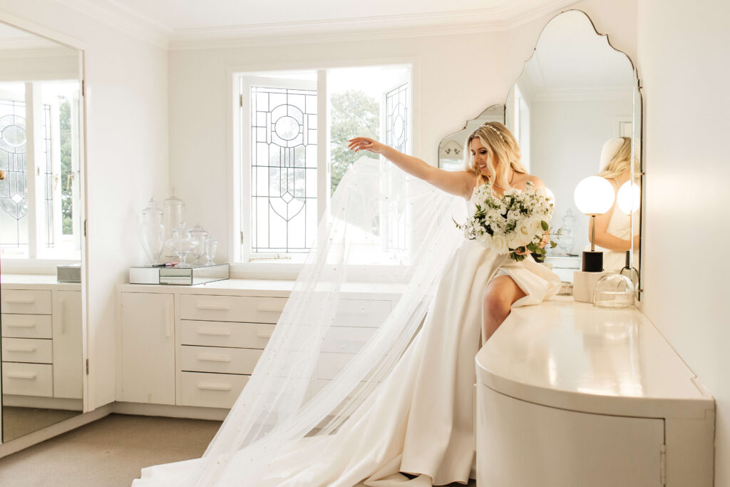 Elegant bridal portrait inside Puketutu Island Estate Spanish Mansion room
