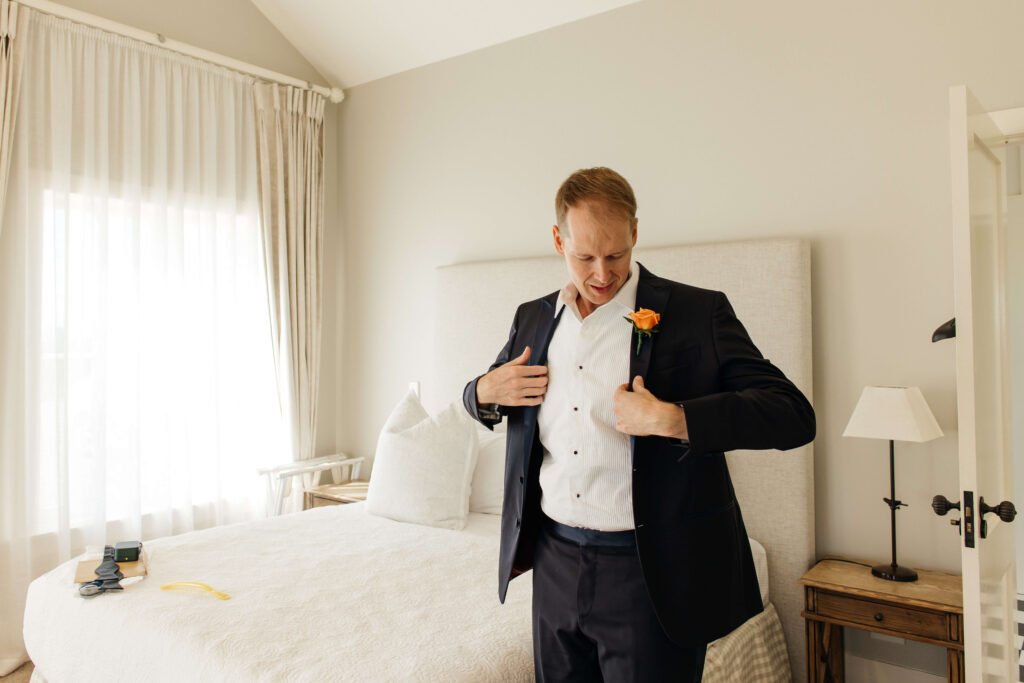 Groom is getting ready at Mudbrick Lodge 