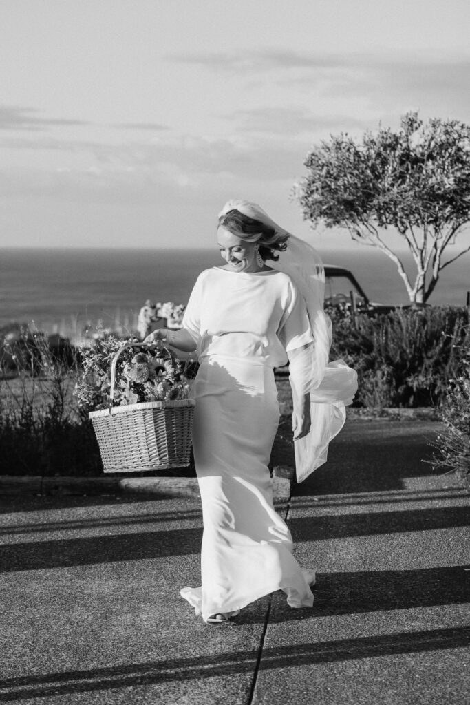 Black and white photo of the bride wearing Lola Varma dress