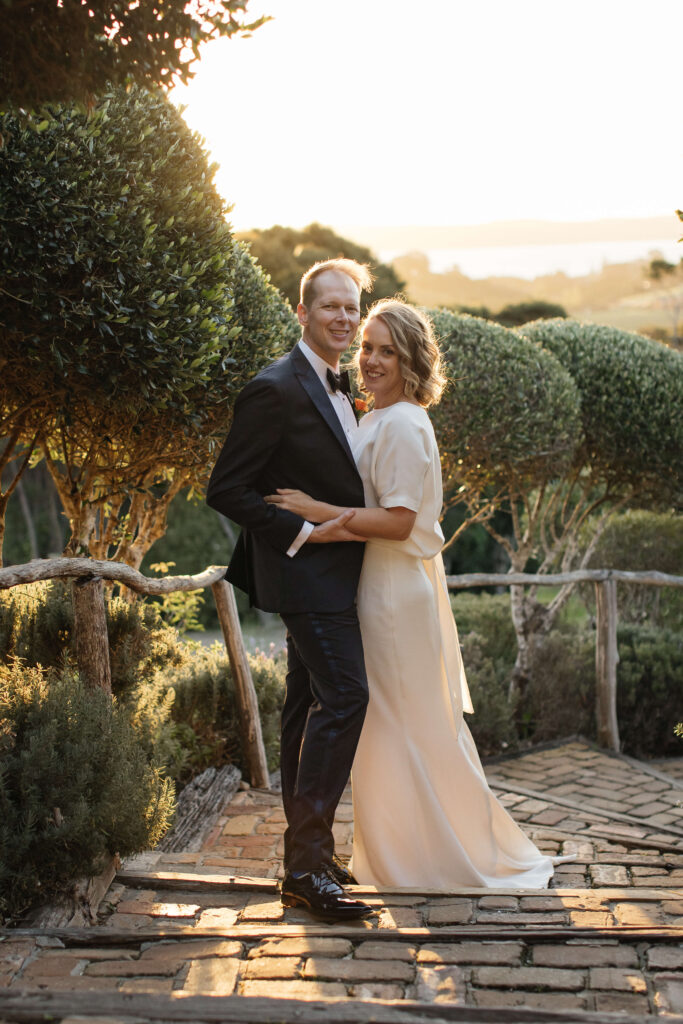 Bride and groom portraits in vineyard during golden hour – autumn wedding at Mudbrick Waiheke Island