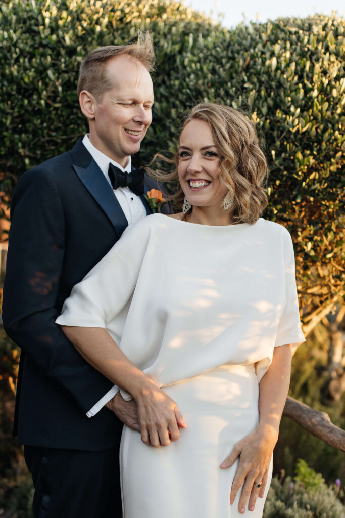 Bride and groom portraits in vineyard during golden hour – autumn wedding at Mudbrick Waiheke Island