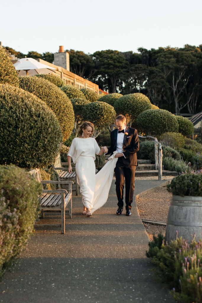 Bride and groom portraits in vineyard during golden hour – autumn wedding at Mudbrick Waiheke Island
