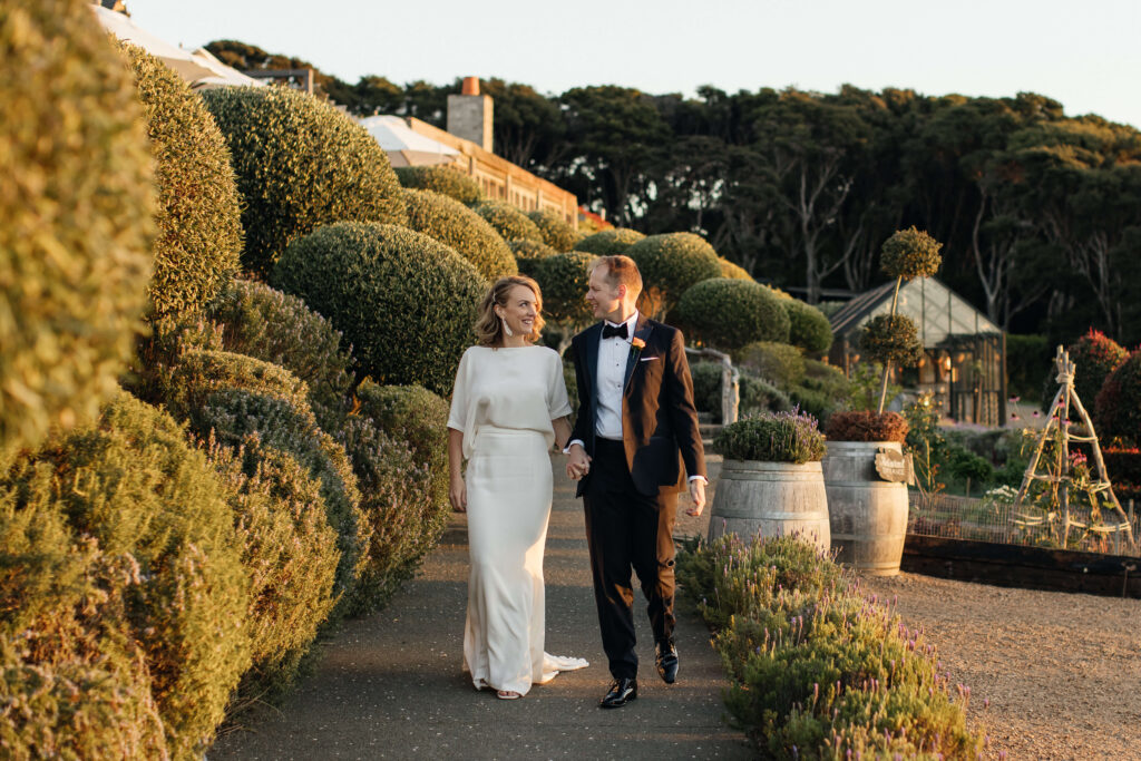 Bride and groom portraits in vineyard during golden hour – autumn wedding at Mudbrick Waiheke Island