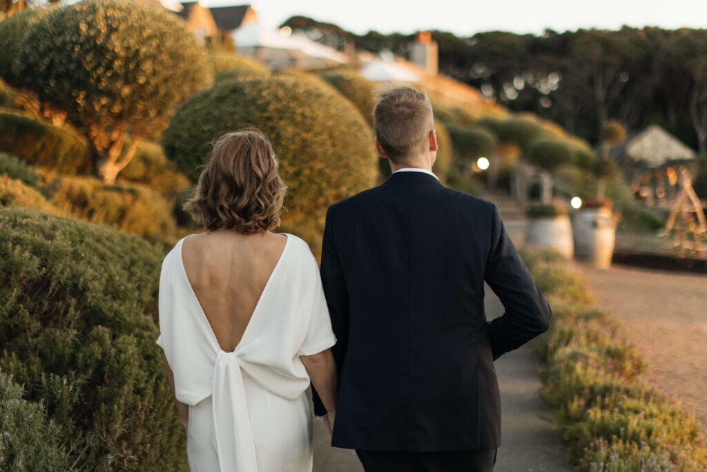 Bride and groom portraits in vineyard during golden hour – autumn wedding at Mudbrick Waiheke Island
