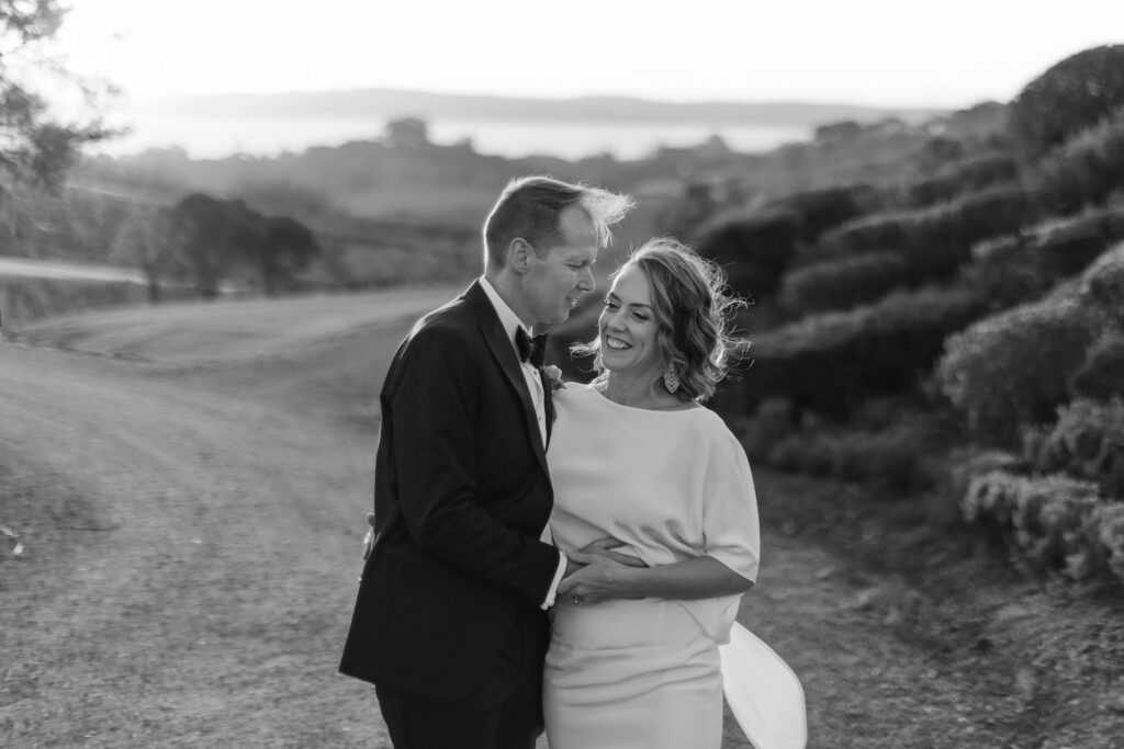 Bride and groom portraits in vineyard during golden hour – autumn wedding at Mudbrick Waiheke Island
