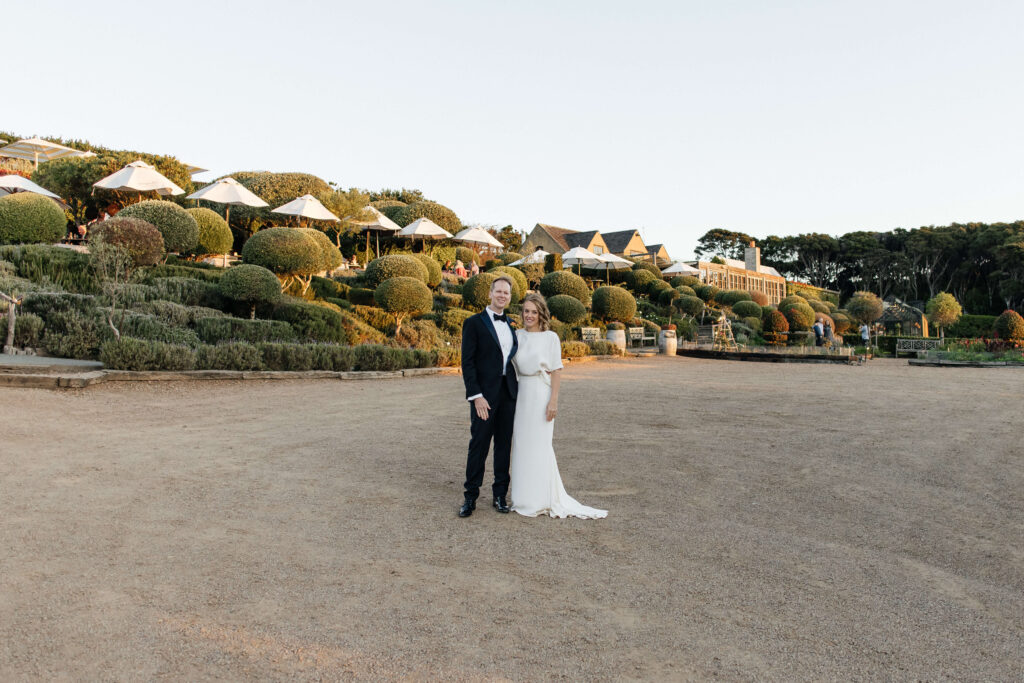 Bride and groom portraits in vineyard during golden hour – autumn wedding at Mudbrick Waiheke Island