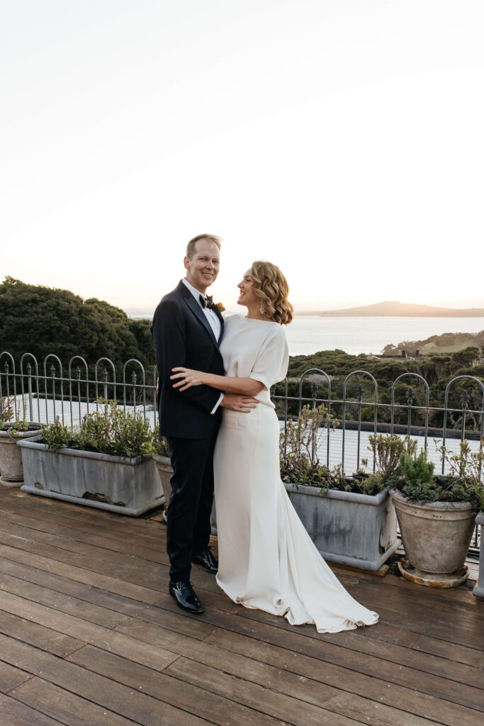 Bride and groom portraits in vineyard during golden hour – autumn wedding at Mudbrick Waiheke Island