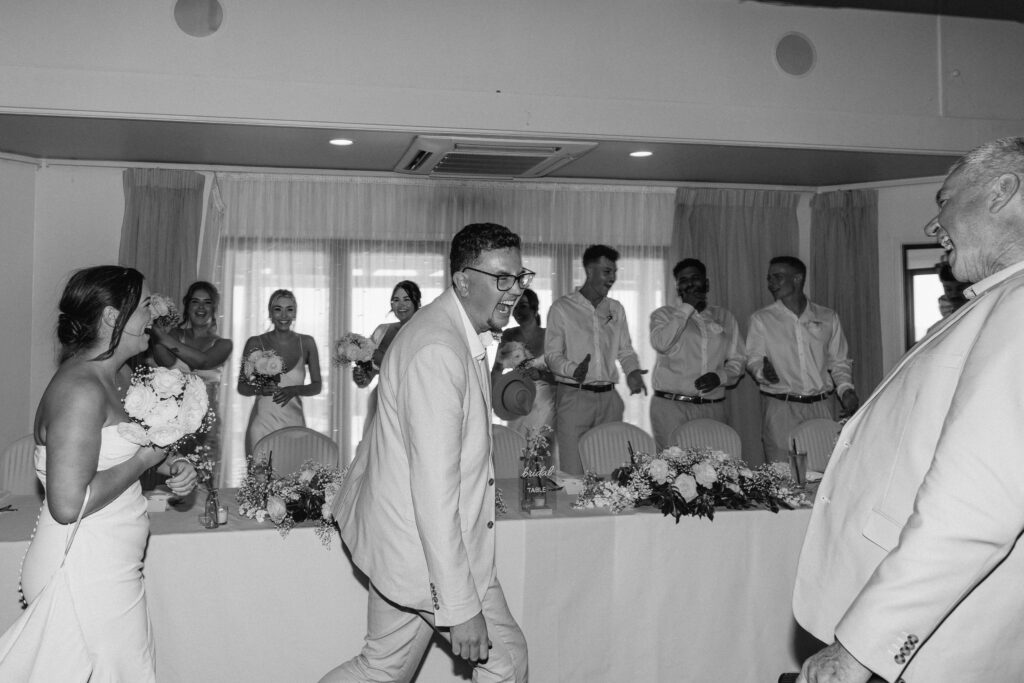 walking in as a husband and wife during reception at Castaways