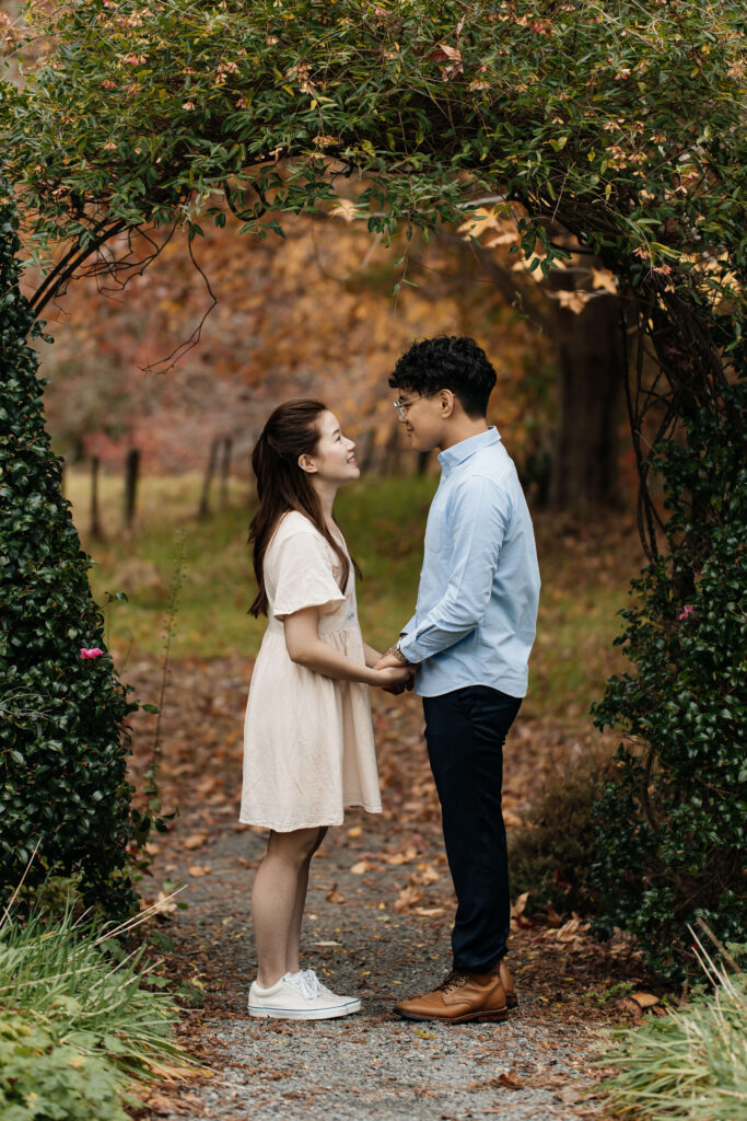 Engaged couple walking through Ayrlies Garden Auckland