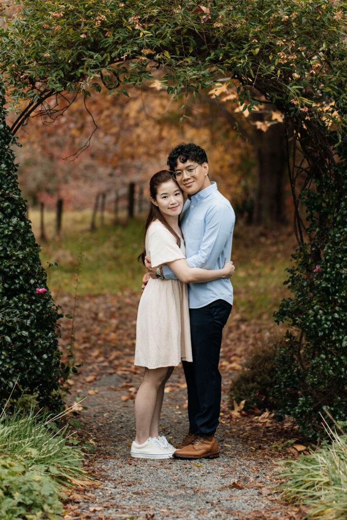 Engaged couple walking through Ayrlies Garden Auckland