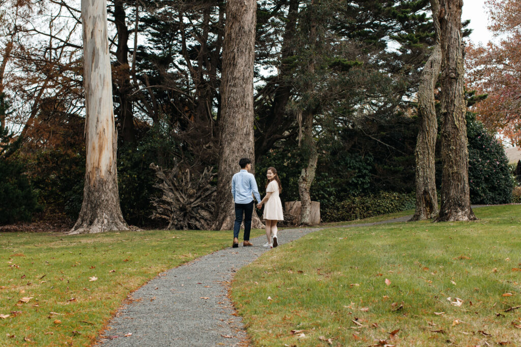 Engaged couple walking through Ayrlies Garden Auckland