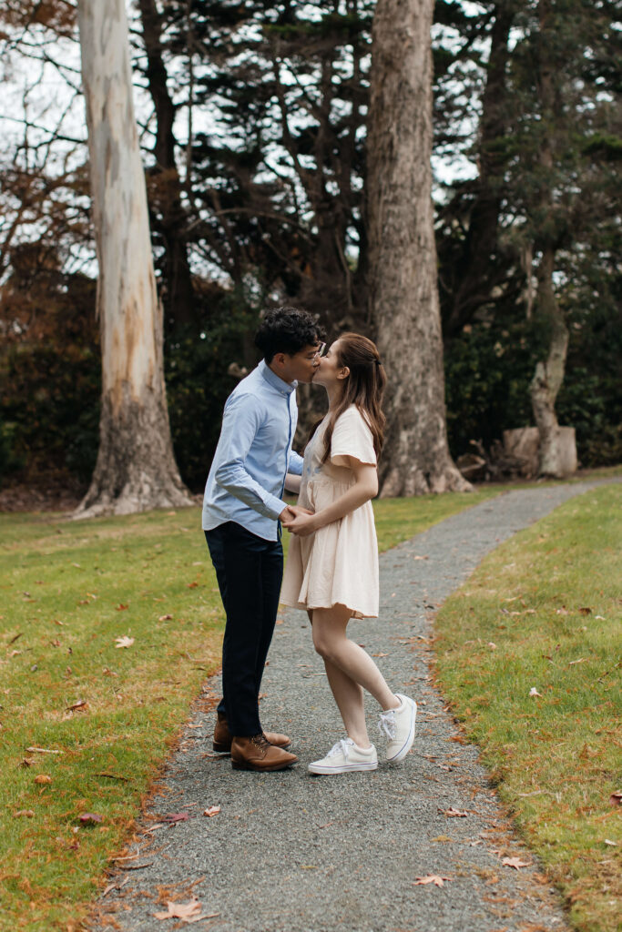 Engaged couple walking through Ayrlies Garden Auckland