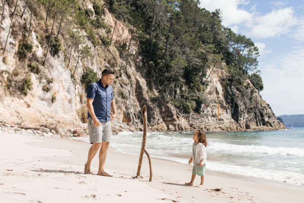 Scenic Hahei Beach backdrop during overseas family photography session