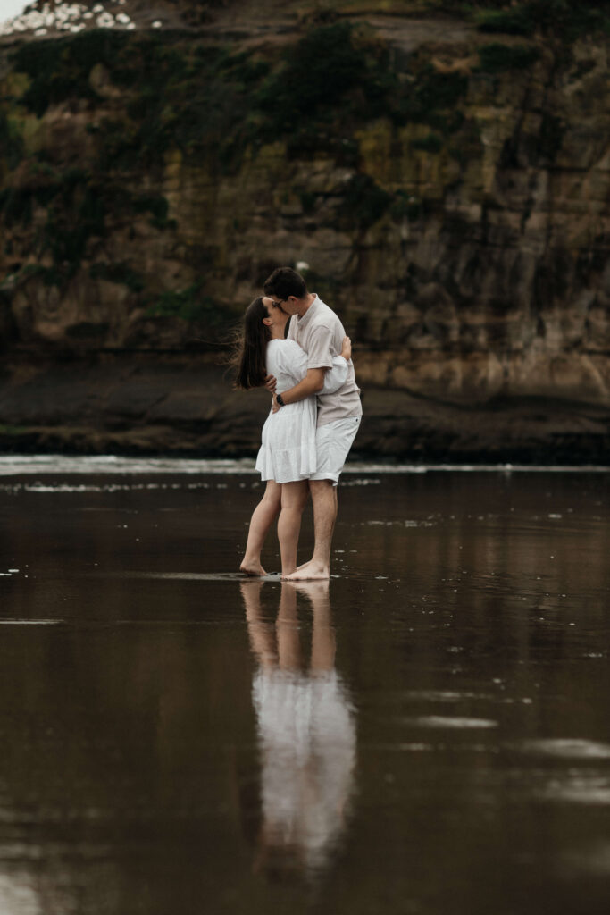 Engagement photos on the beach on a rainy day