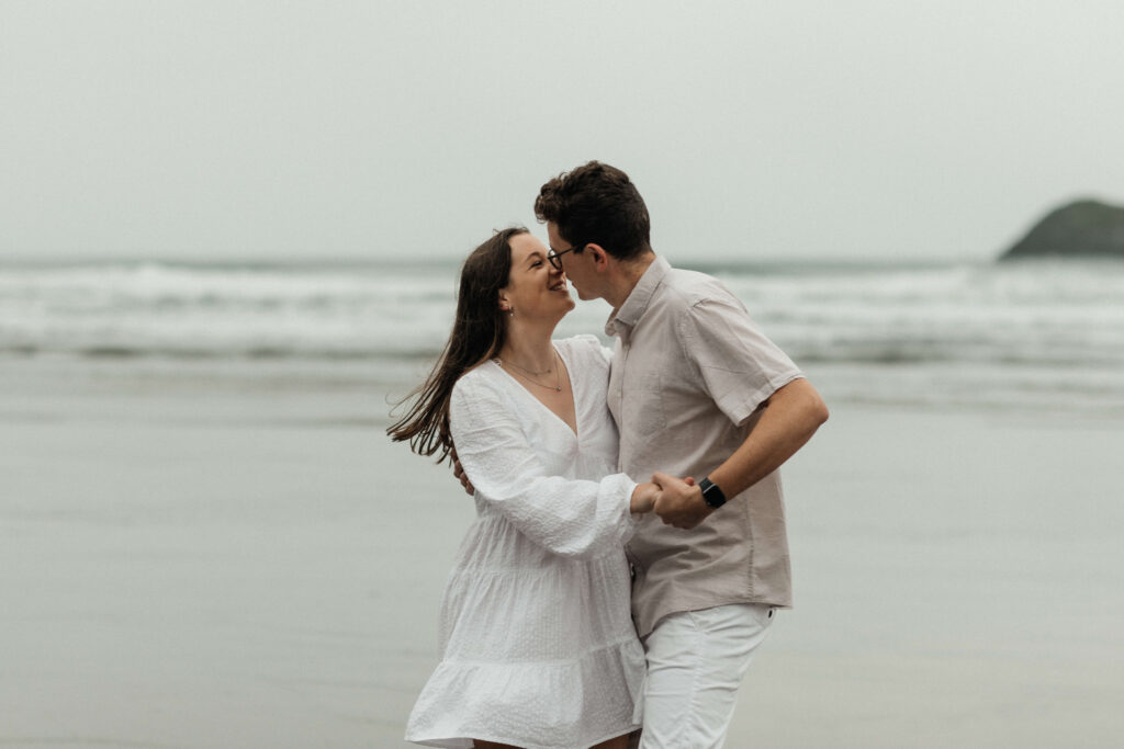 Engagement photos on the beach on a rainy day