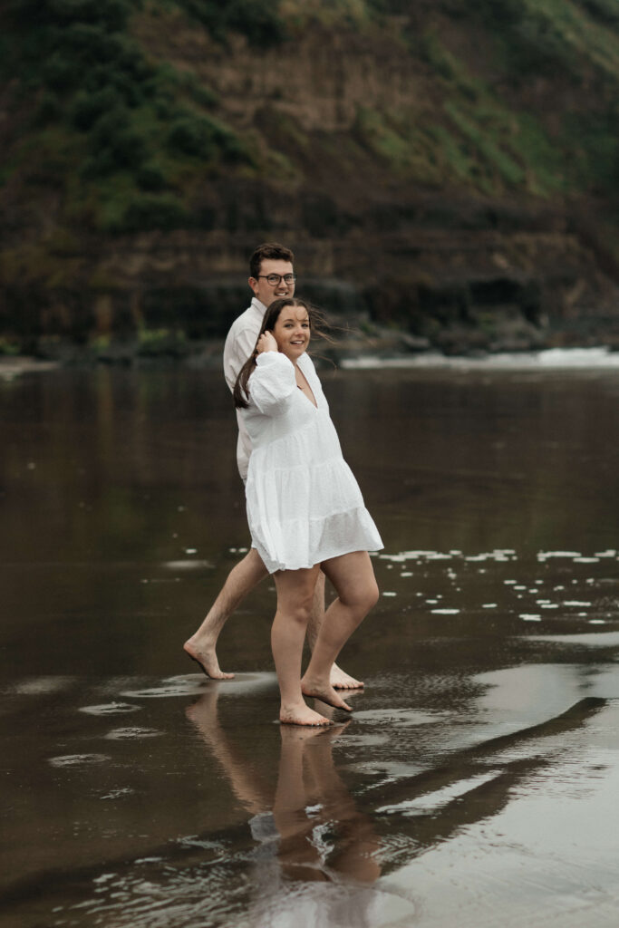 Engagement photos on the beach on a rainy day