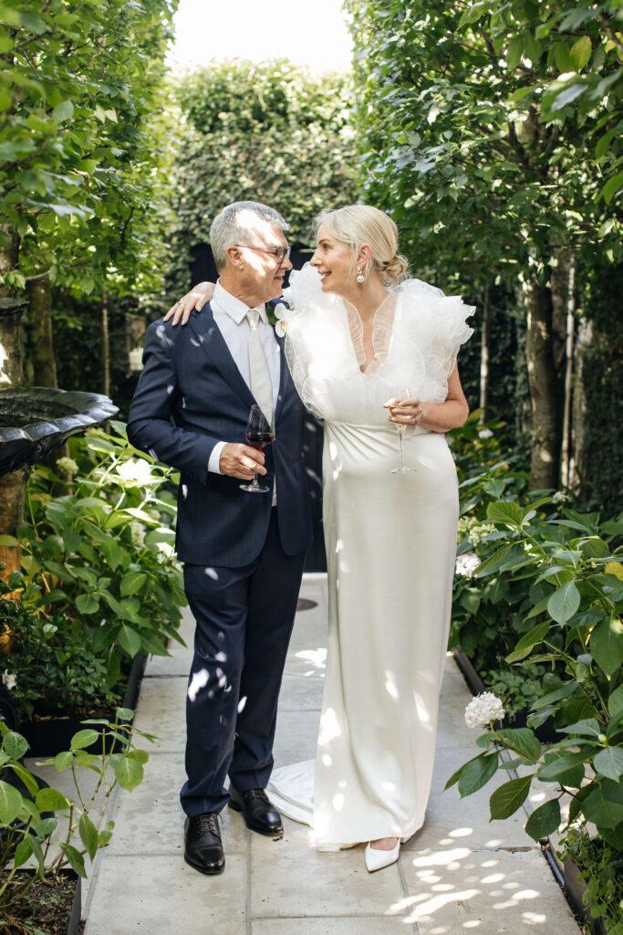 Candid wedding photography of Angela and David laughing during their intimate PAX Venue Auckland wedding.