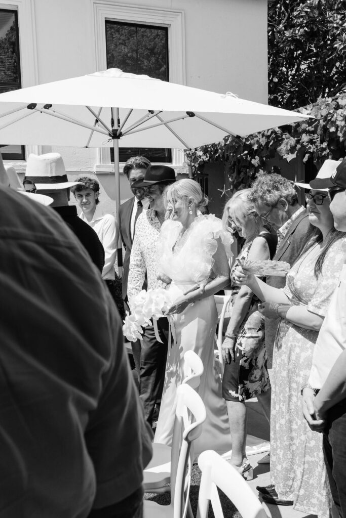 Bride Angela walking down the aisle at intimate PAX Venue Auckland wedding