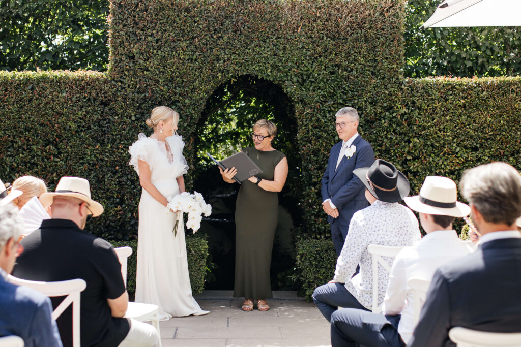 Angela and David’s intimate ceremony at PAX Venue Auckland wedding with elegant floral arrangements