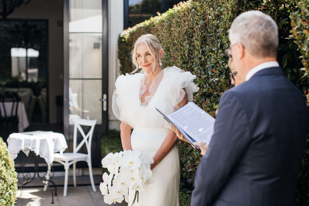 Angela and David’s intimate ceremony at PAX Venue Auckland wedding with elegant floral arrangements