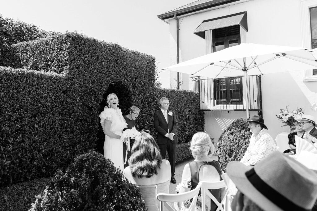 Angela and David’s intimate ceremony at PAX Venue Auckland wedding with elegant floral arrangements
