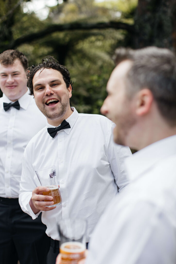 Groom getting ready in Auckland with groomsmen
