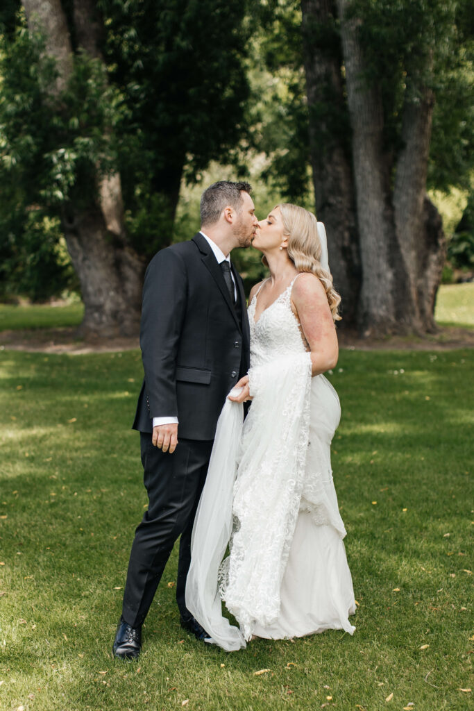 Bride and groom sharing a private first look in the gardens of Abel Estate before their Auckland wedding ceremony.