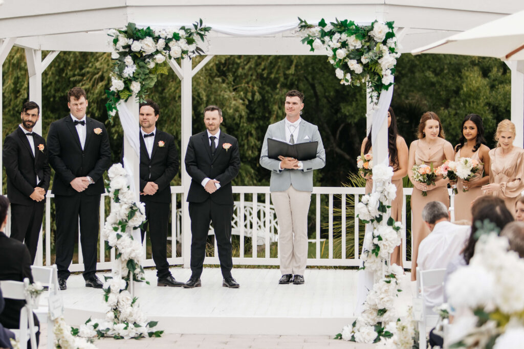 Beautifully styled ceremony setup at Abel Estate in Kumeū with floral arrangements and garden views.