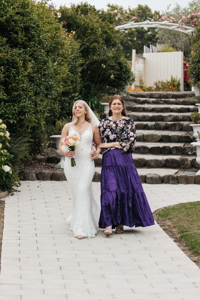 Beautifully styled ceremony setup at Abel Estate in Kumeū with floral arrangements and garden views.