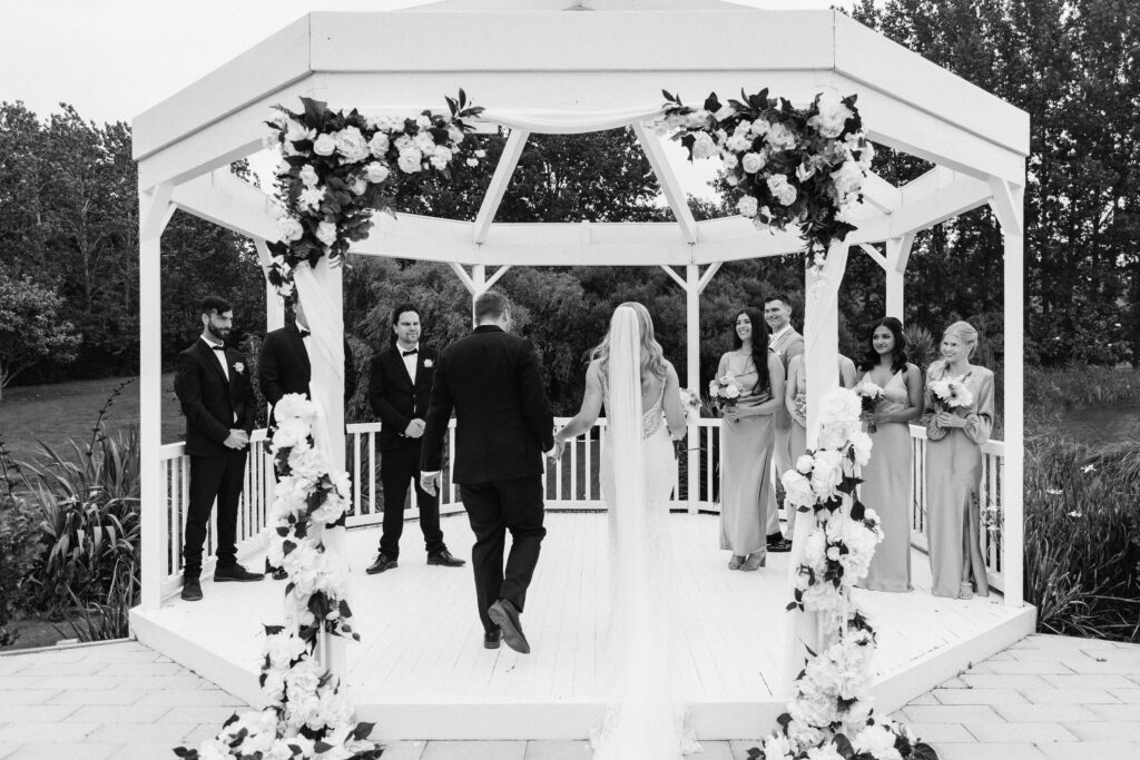 Beautifully styled ceremony setup at Abel Estate in Kumeū with floral arrangements and garden views.