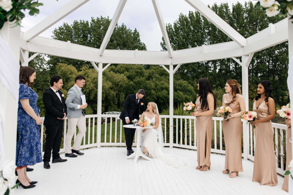 Beautifully styled ceremony setup at Abel Estate in Kumeū with floral arrangements and garden views.