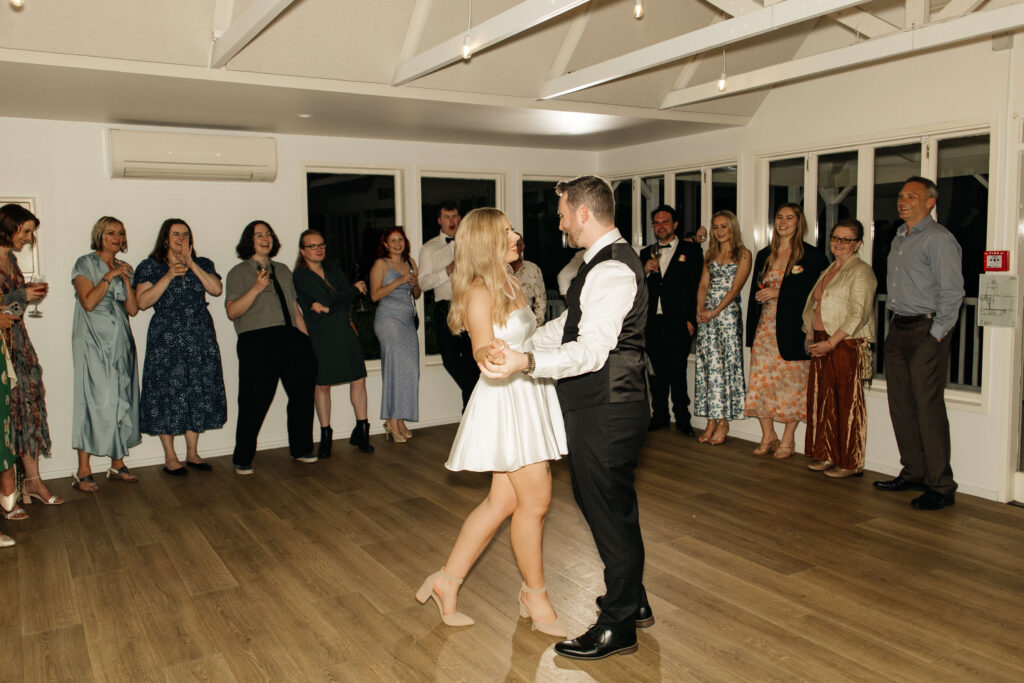 Bride and groom sharing their first dance at Abel Estate wedding reception in Kumeū.