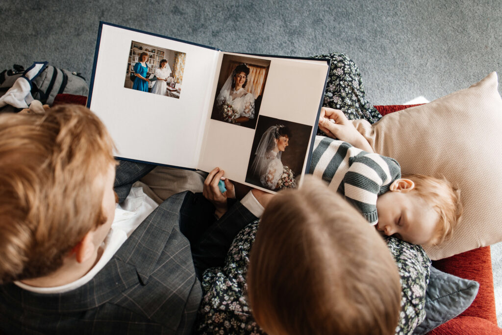 Relaxed family portrait of mum, dad, and son together in their home – a lifestyle family photoshoot capturing everyday moments.