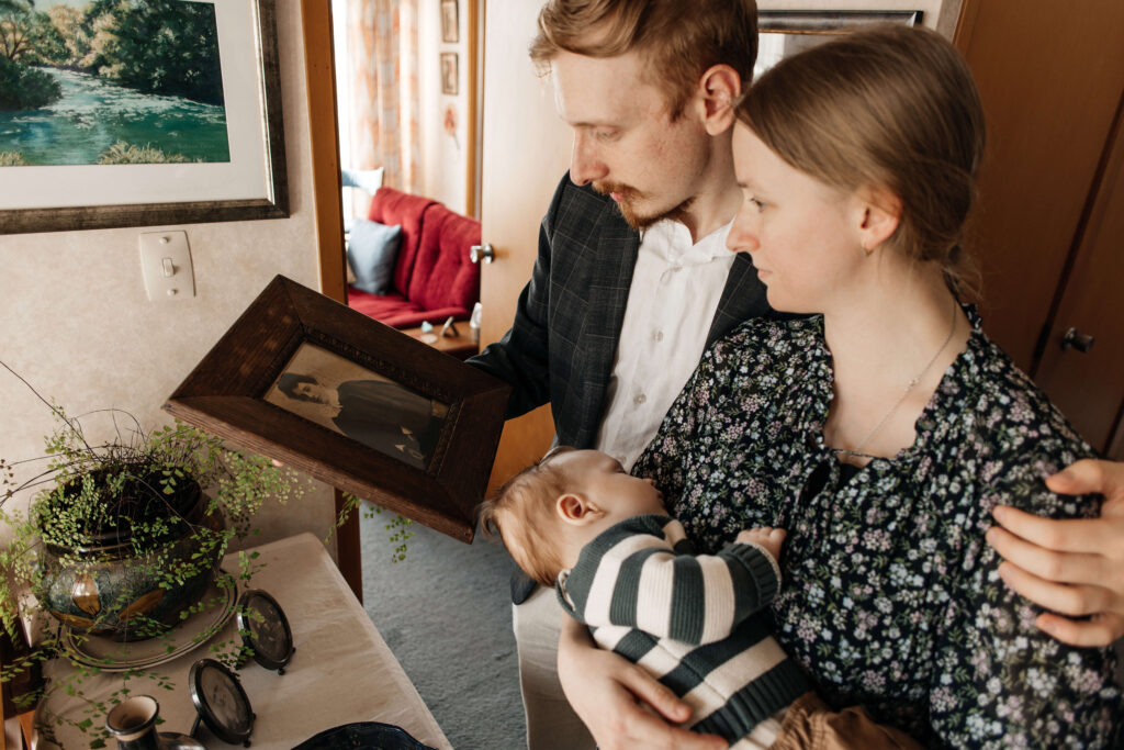 Relaxed family portrait of mum, dad, and son together in their home – a lifestyle family photoshoot capturing everyday moments.
