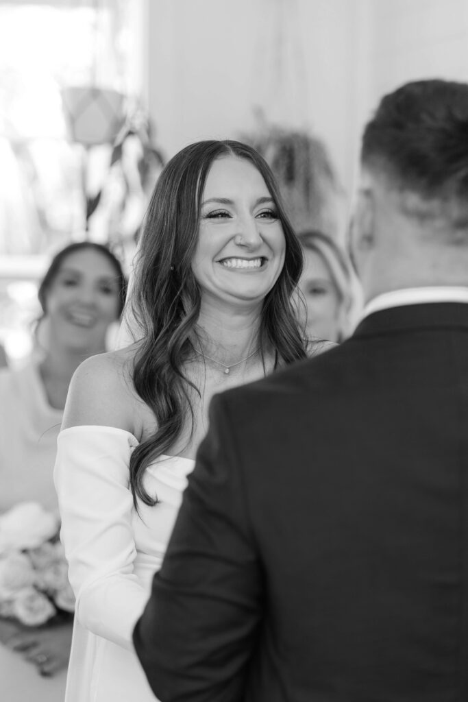 Couple exchanging vows inside Old Forest School house wedding ceremony venue.