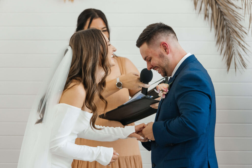 Couple exchanging vows inside Old Forest School house wedding ceremony venue.