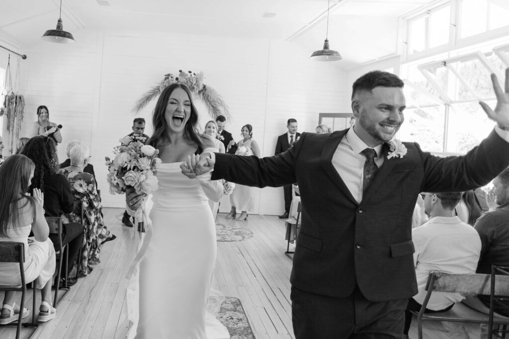 Couple exchanging vows inside Old Forest School house wedding ceremony venue.
