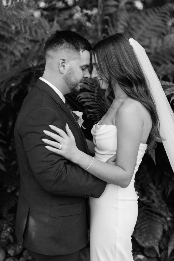 Romantic couple portraits at Old Forest School wedding venue gardens.