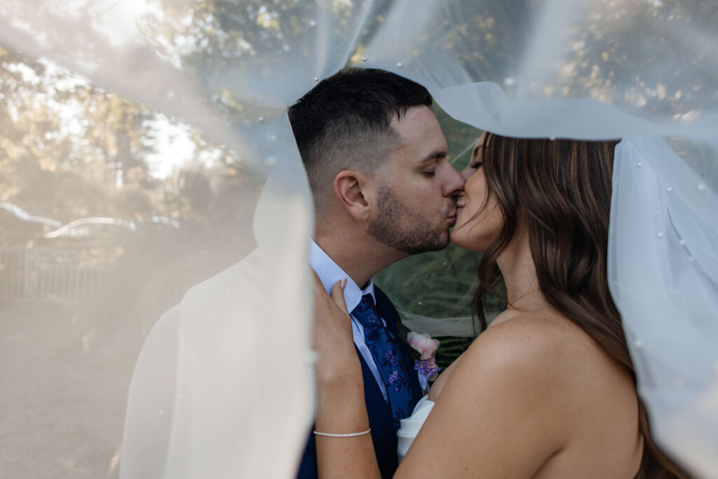 Romantic couple portraits at Old Forest School wedding venue gardens.