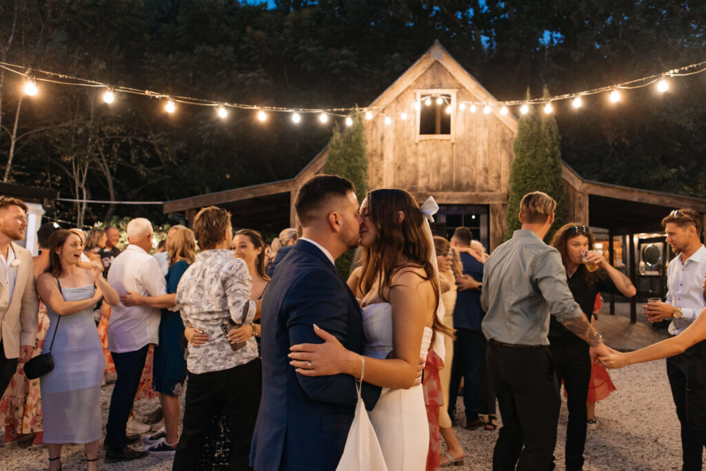 First Dance under festoon lights at Old Forest School wedding reception.