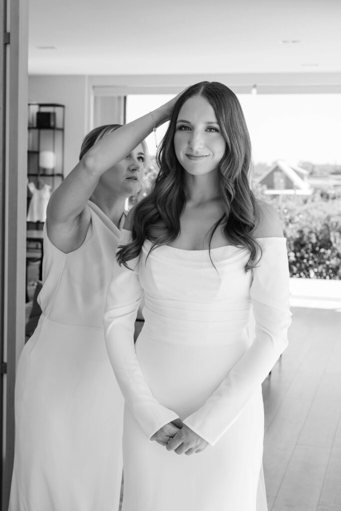 Bride getting ready for her Old Forest School wedding at beachfront accommodation in Pukehina.