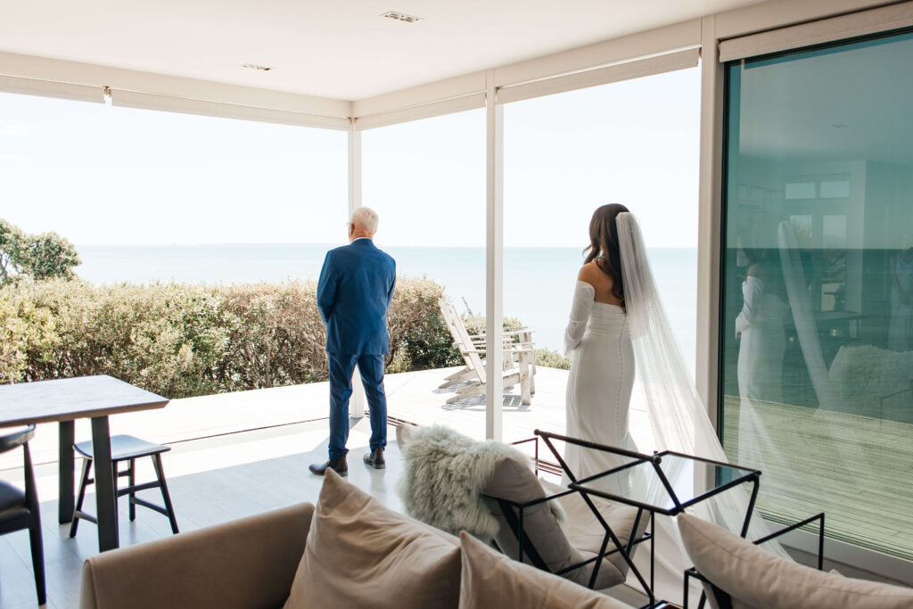 Bride shares emotional first look with father before Old Forest School wedding ceremony.